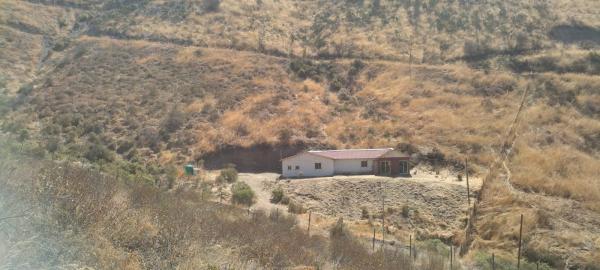 PARCELA 6.000 M2 CON CASA CASI TERMINADA DE 132 M2